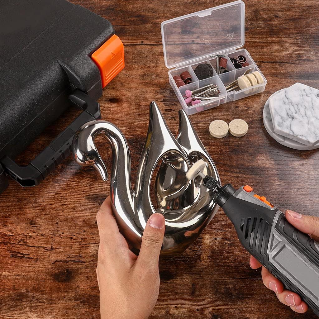 Rotary tool with a felt wheel attachment being used to polish a decorative metal swan
