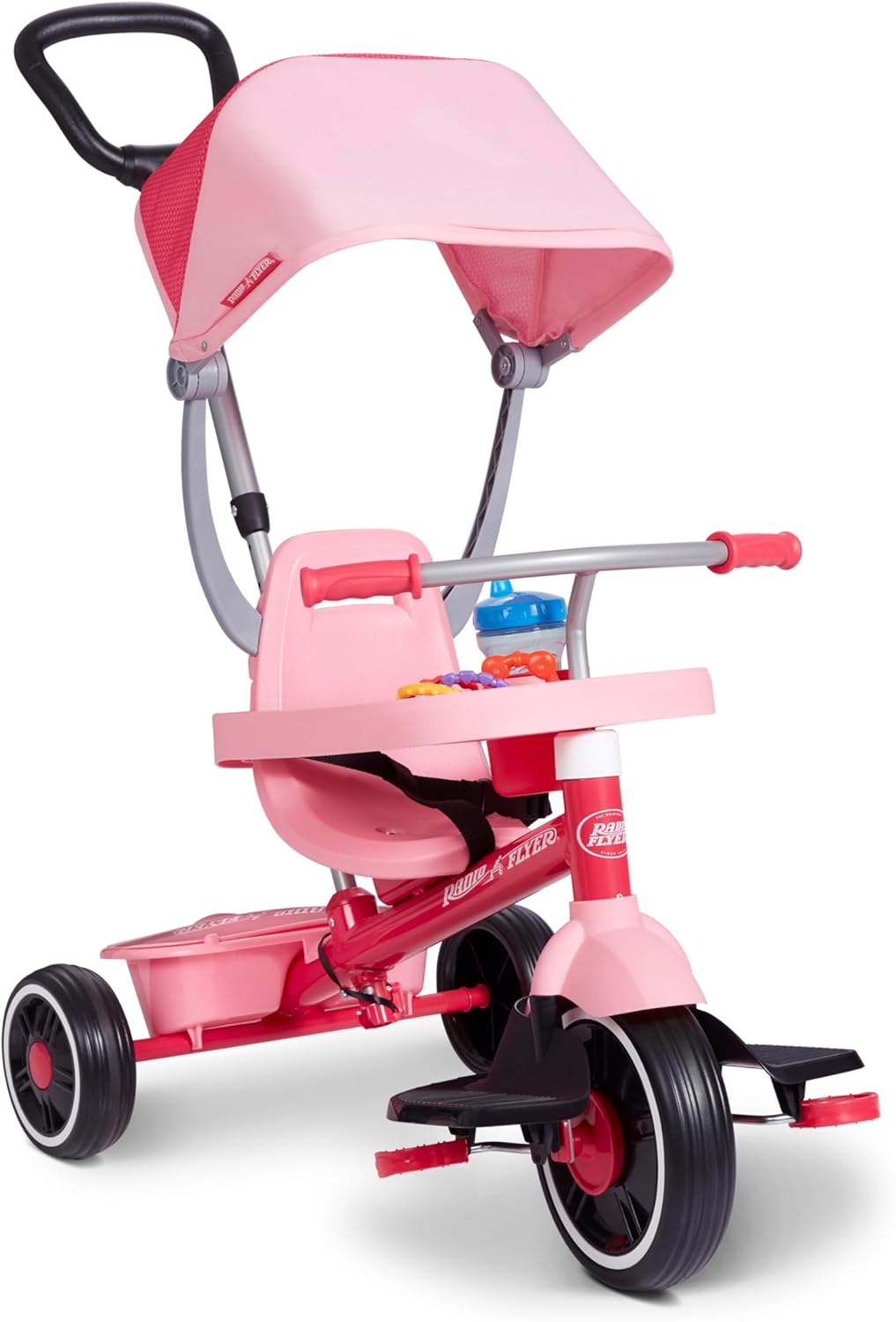 The pink Radio Flyer 4-in-1 Stroll 'N Trike with all accessories attached, including the canopy, tray, and parent push handle.