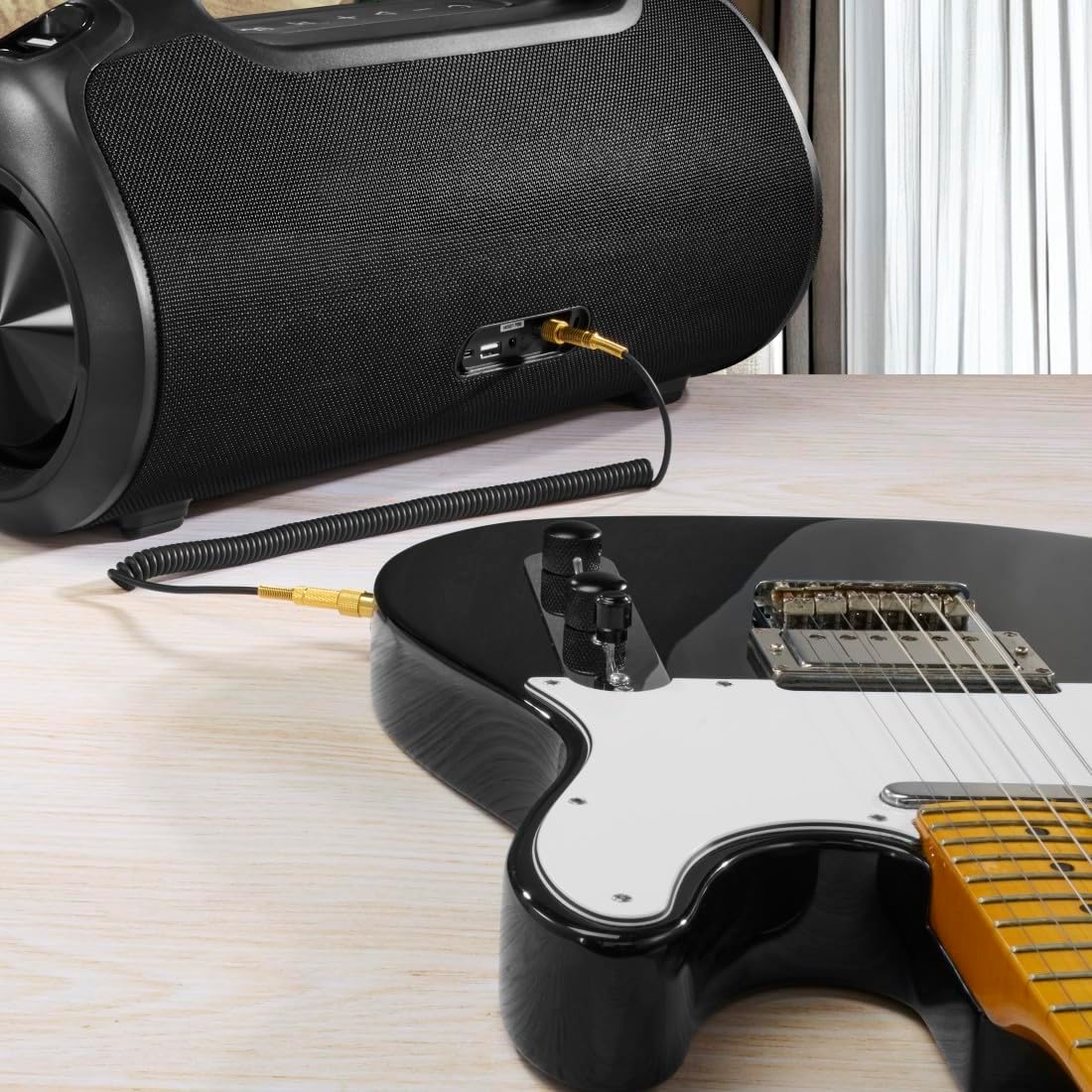 Hama Ultimate Pro speaker connected to an electric guitar via a 6.3mm jack cable.