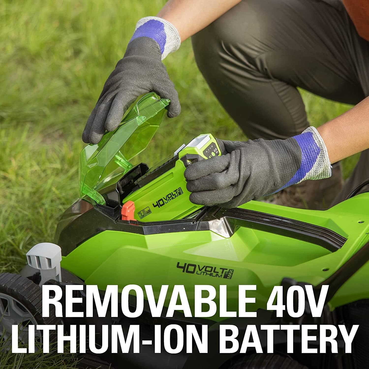 Removable 40V Lithium-Ion Battery being inserted into the Greenworks lawn mower.