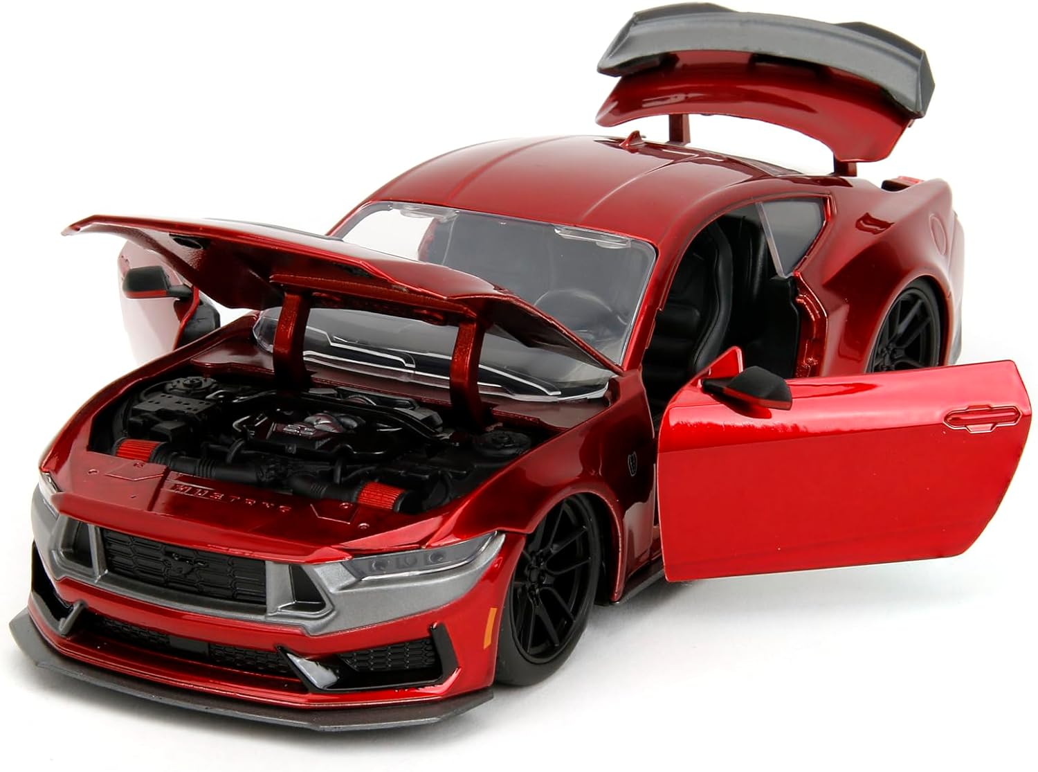 The Jada 1:24 2024 Ford Mustang Dark Horse die-cast model with its hood, doors, and trunk open, revealing interior and engine details.