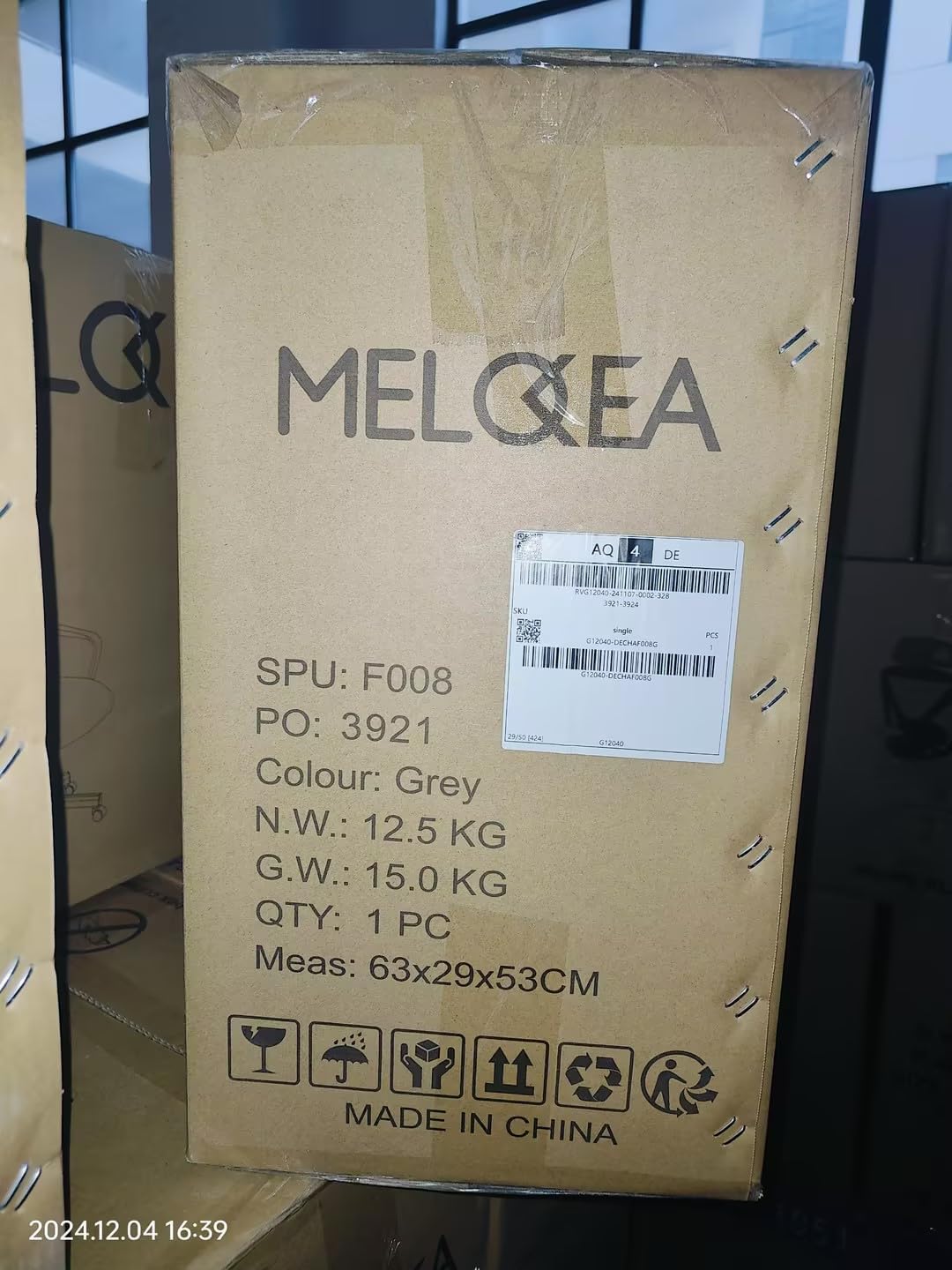 MELOKEA chair box with shipping labels and product information