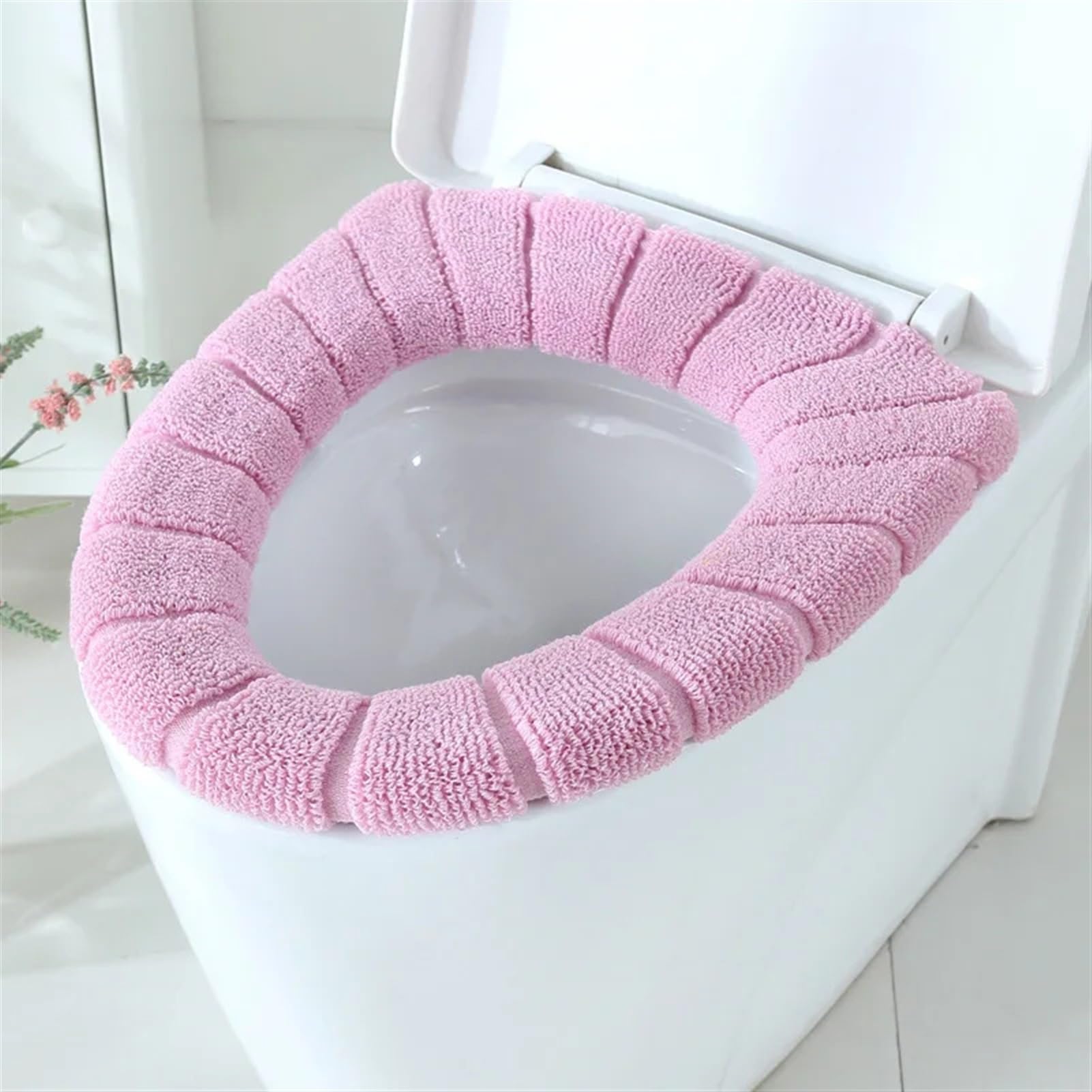 Fini les toilettes froides en hiver avec ce couvre-siège rembourré rose lavable