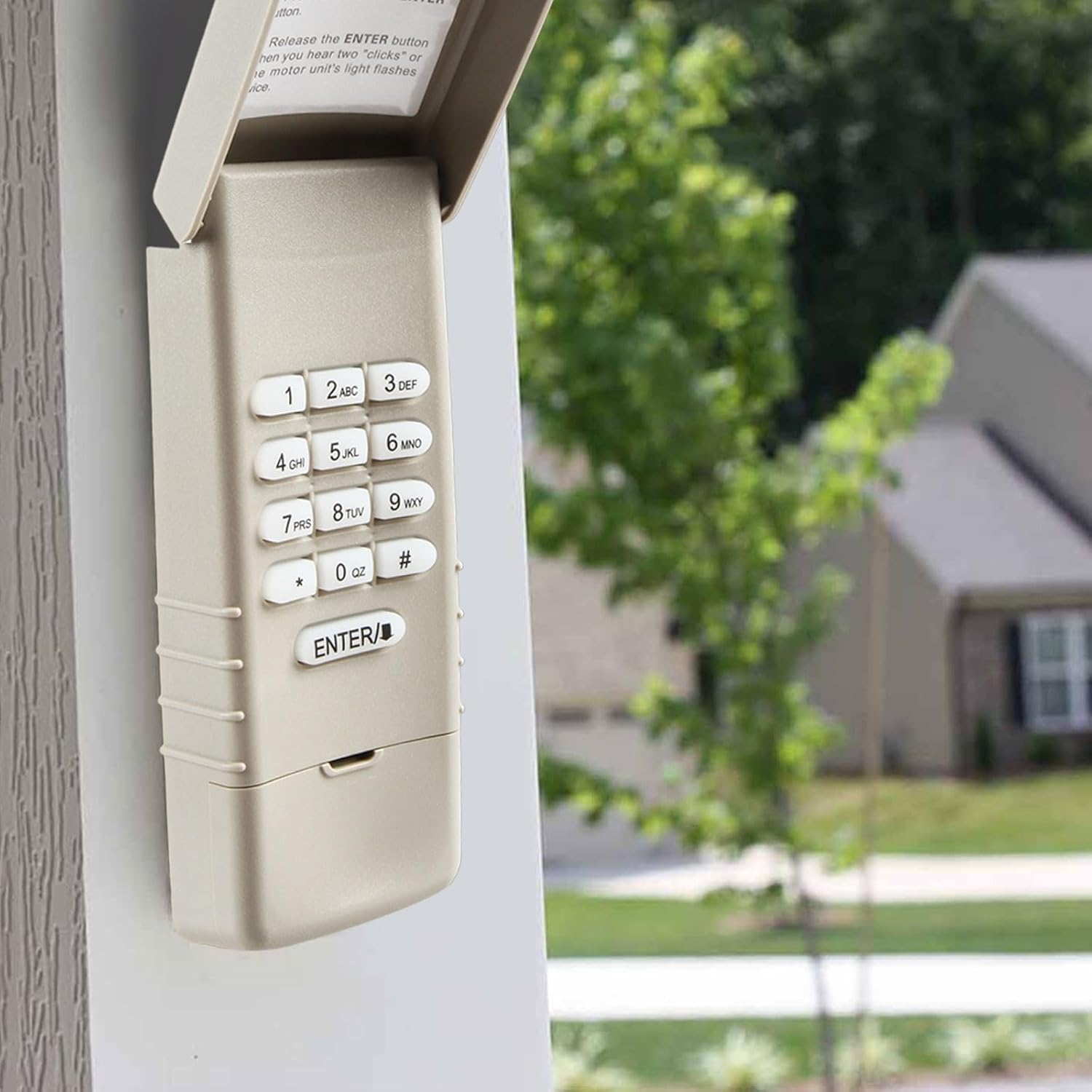 Garage Outlet Keyless Keypad mounted on an exterior wall next to a garage door