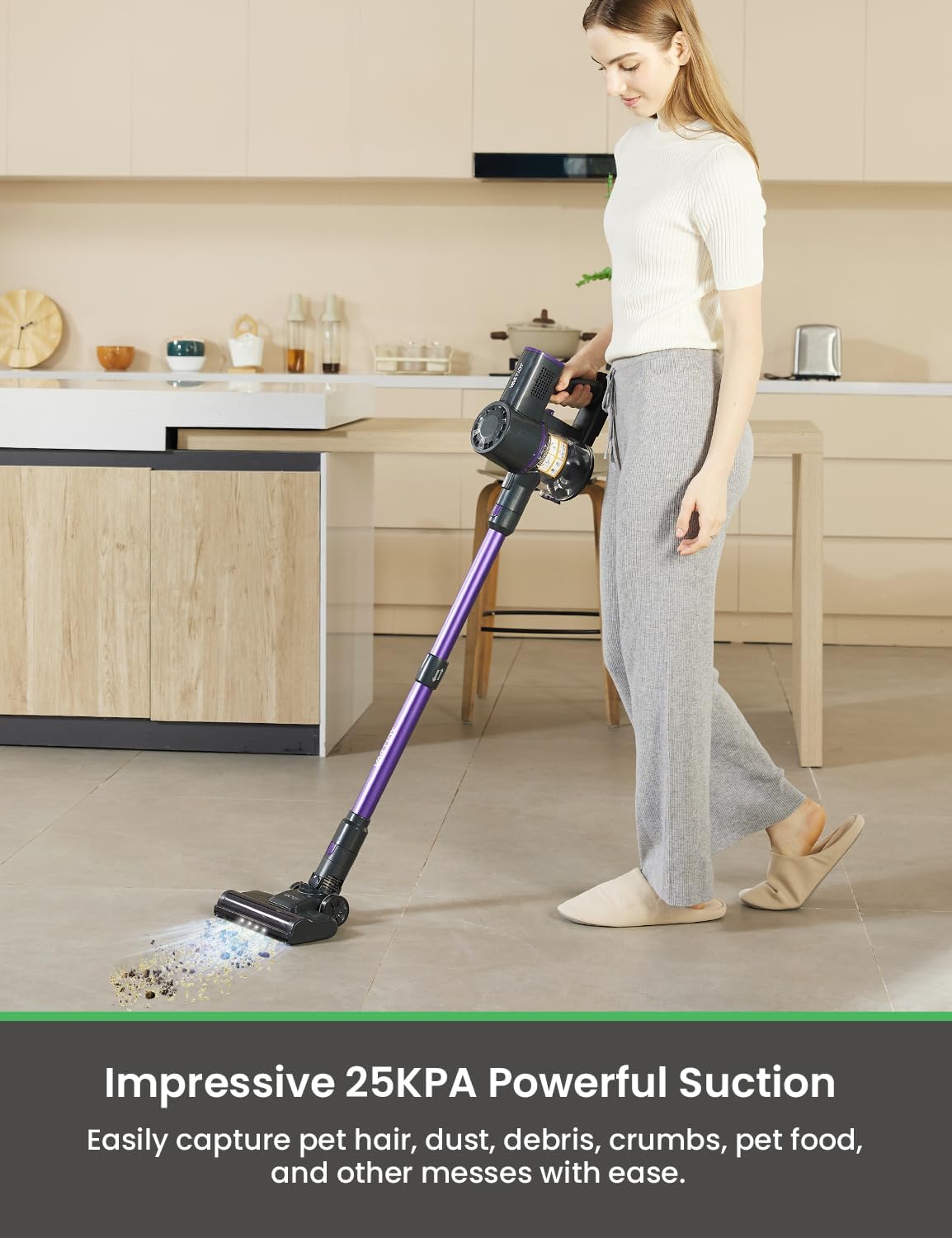 Woman using the Vactidy cordless vacuum on a hard floor, showing powerful suction