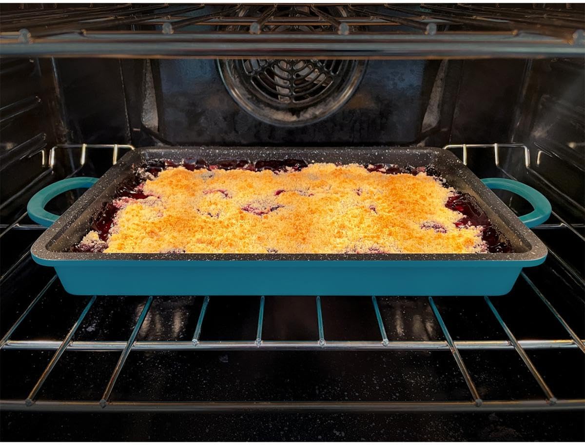 Curtis Stone Dura-Pan+ 2-in-1 Baker/Griddle Pan with silicone mat and salmon fillets.