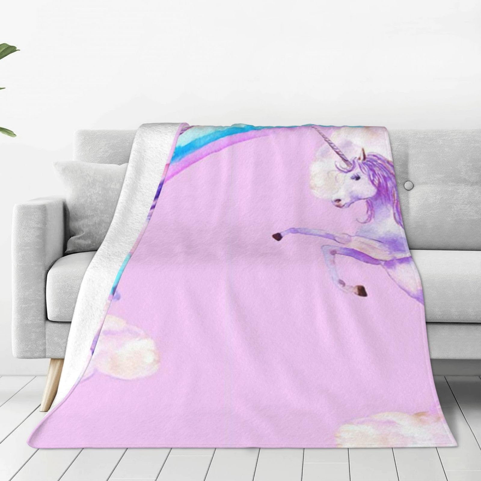 Plaid licorne rose pour moments de détente sur le canapé du salon