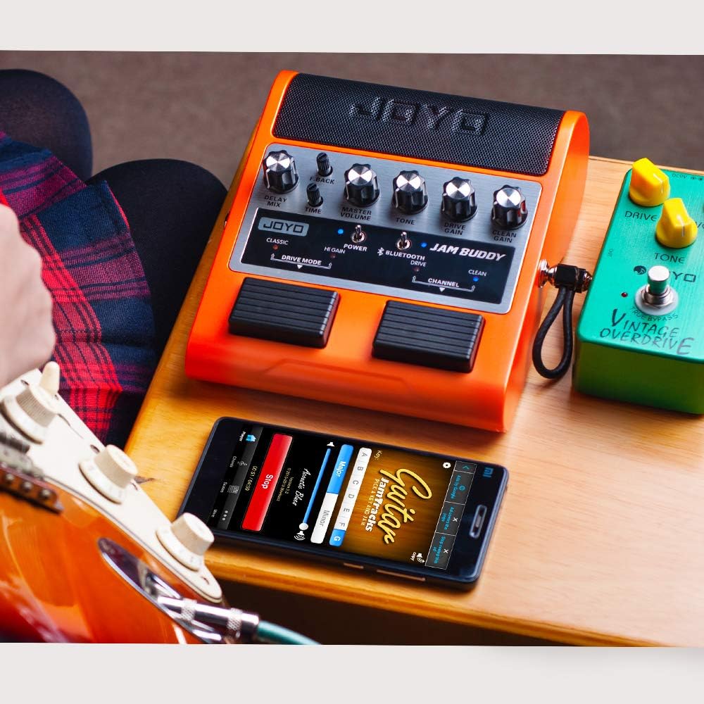 JOYO JAM Buddy connected to a guitar and smartphone via Bluetooth