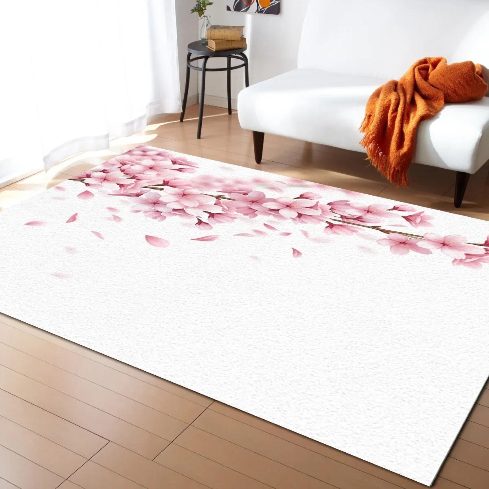 Alfombra rosa con flor de cerezo para crear un rincon de relax en tu sala de estar