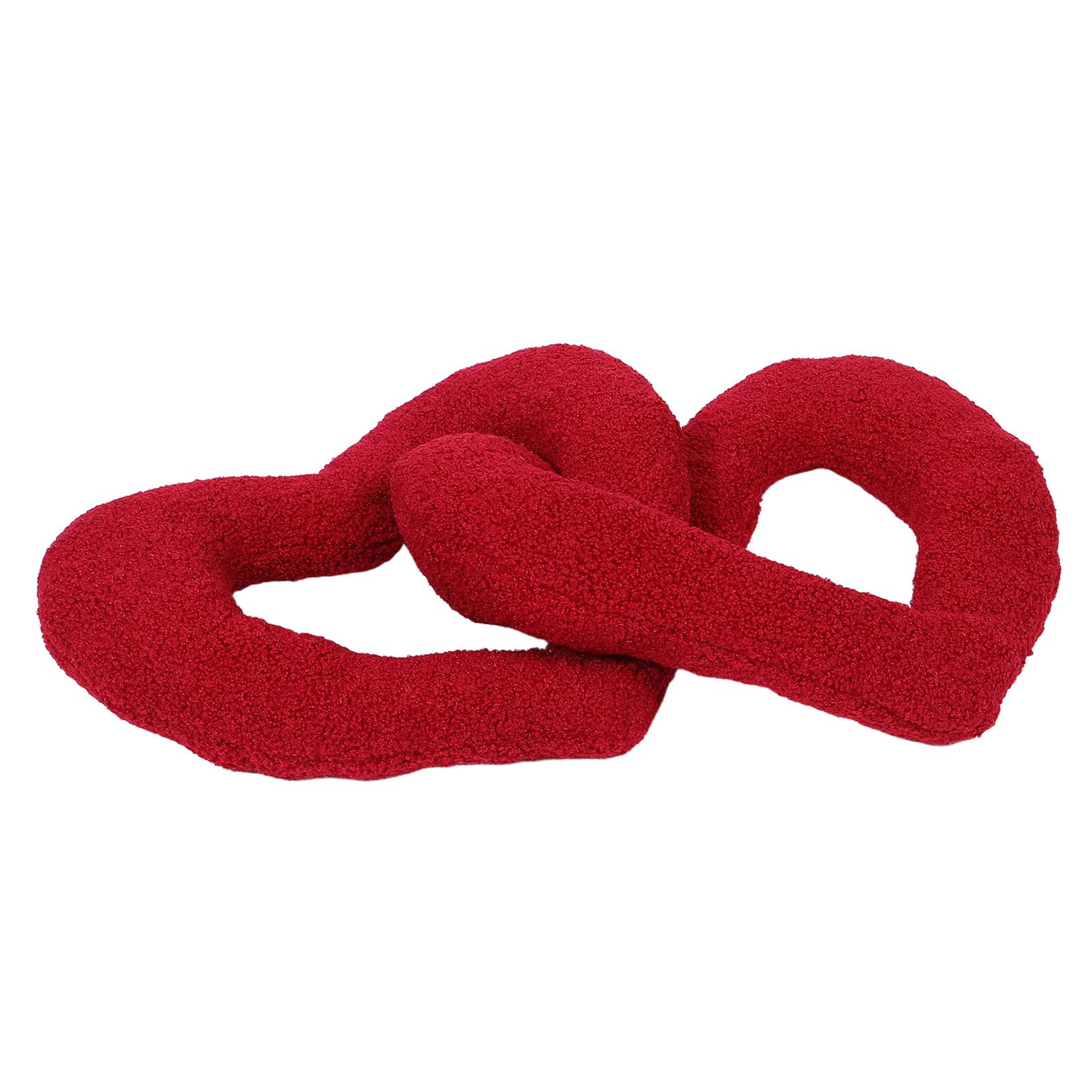 Coussin cœur contre le mal de dos sur canapé et chevet