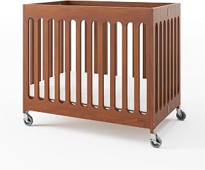 Foundations Boutique Compact Folding Crib, Modern, Contemporary, Mini Crib for Guest Rooms, Vacation Homes, and Small Nurseries, Available in 5 Finishes, Mattress Included (Cherry)