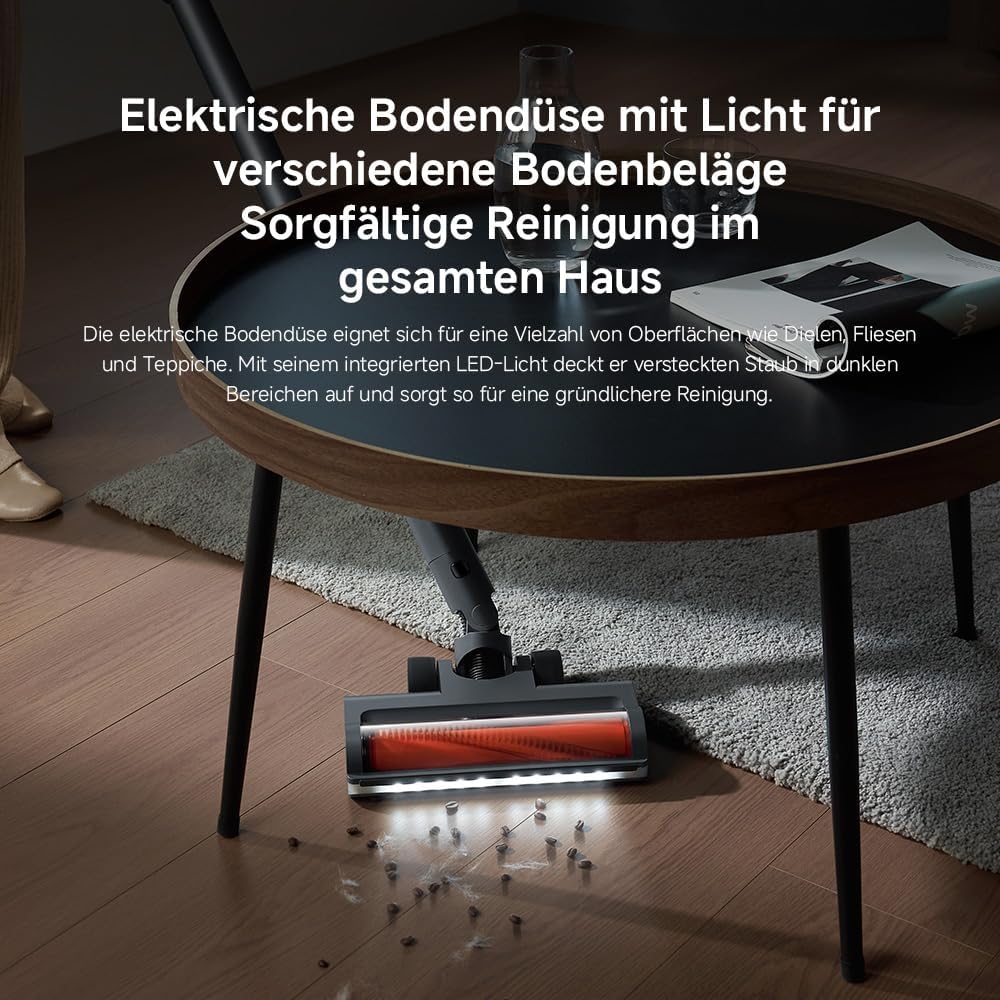 Vacuum cleaner floor nozzle with LED lights illuminating dust on a wooden floor