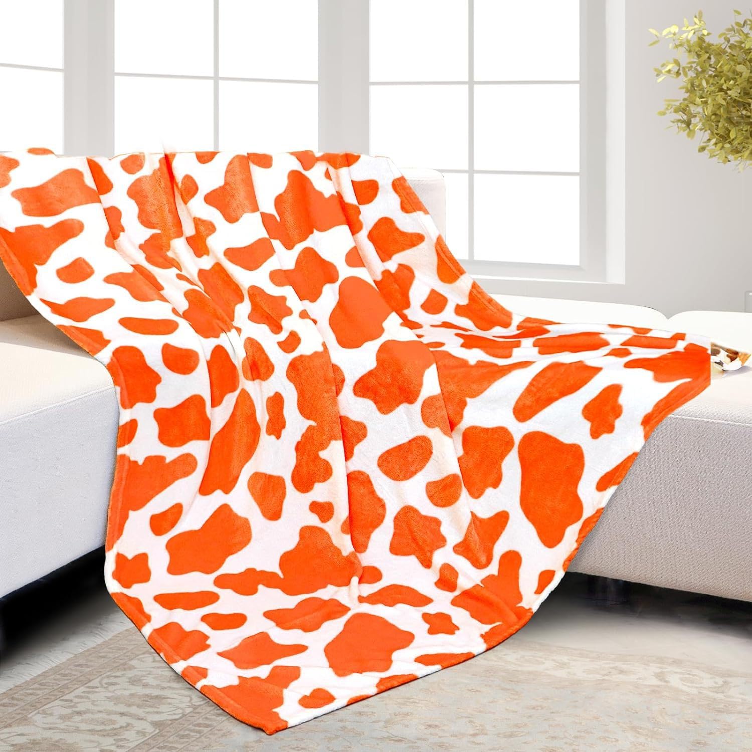 Couverture en flanelle imprimée vache pour vos soirées cocooning sur le canapé