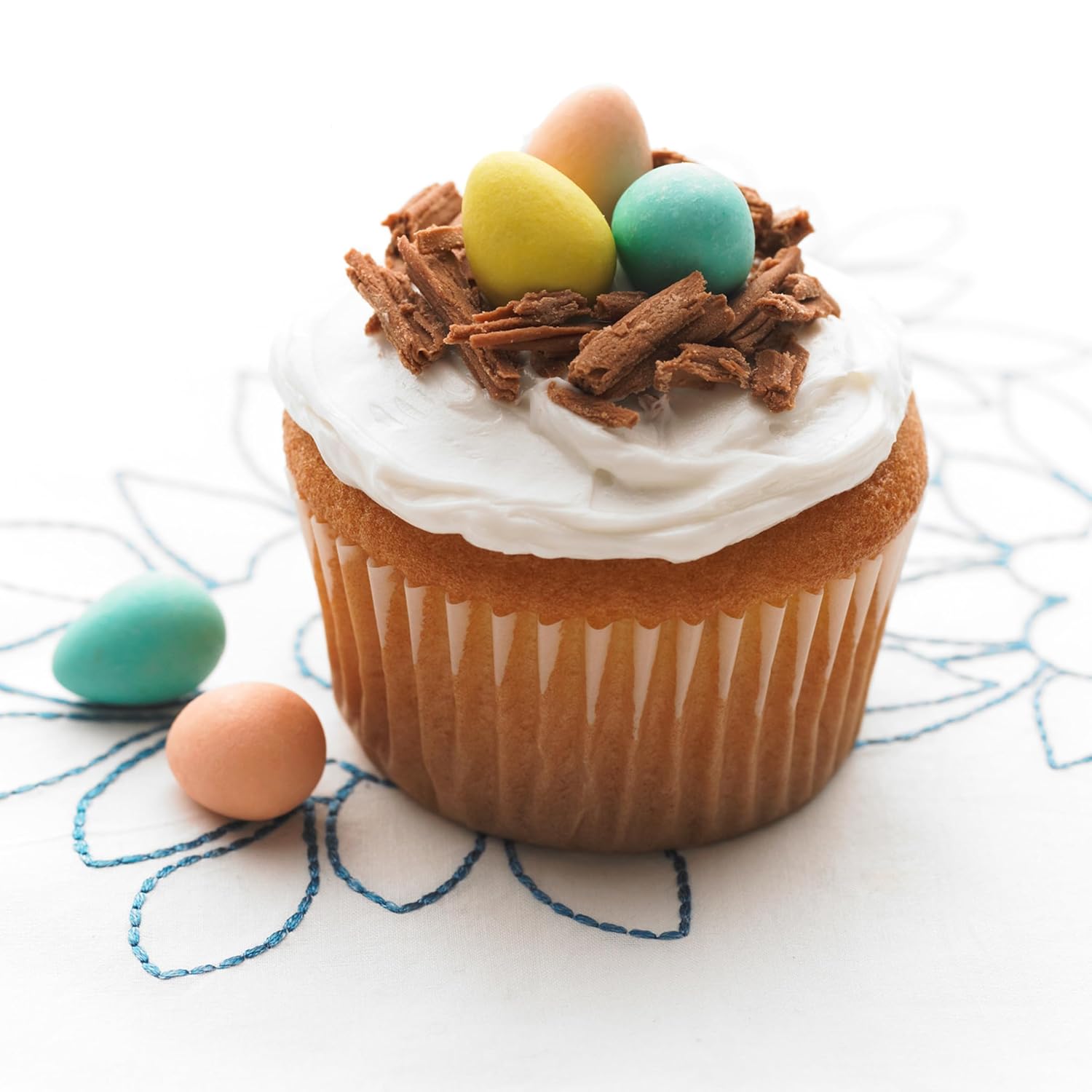 Cadbury Mini Easter Eggs on a frosted cupcake