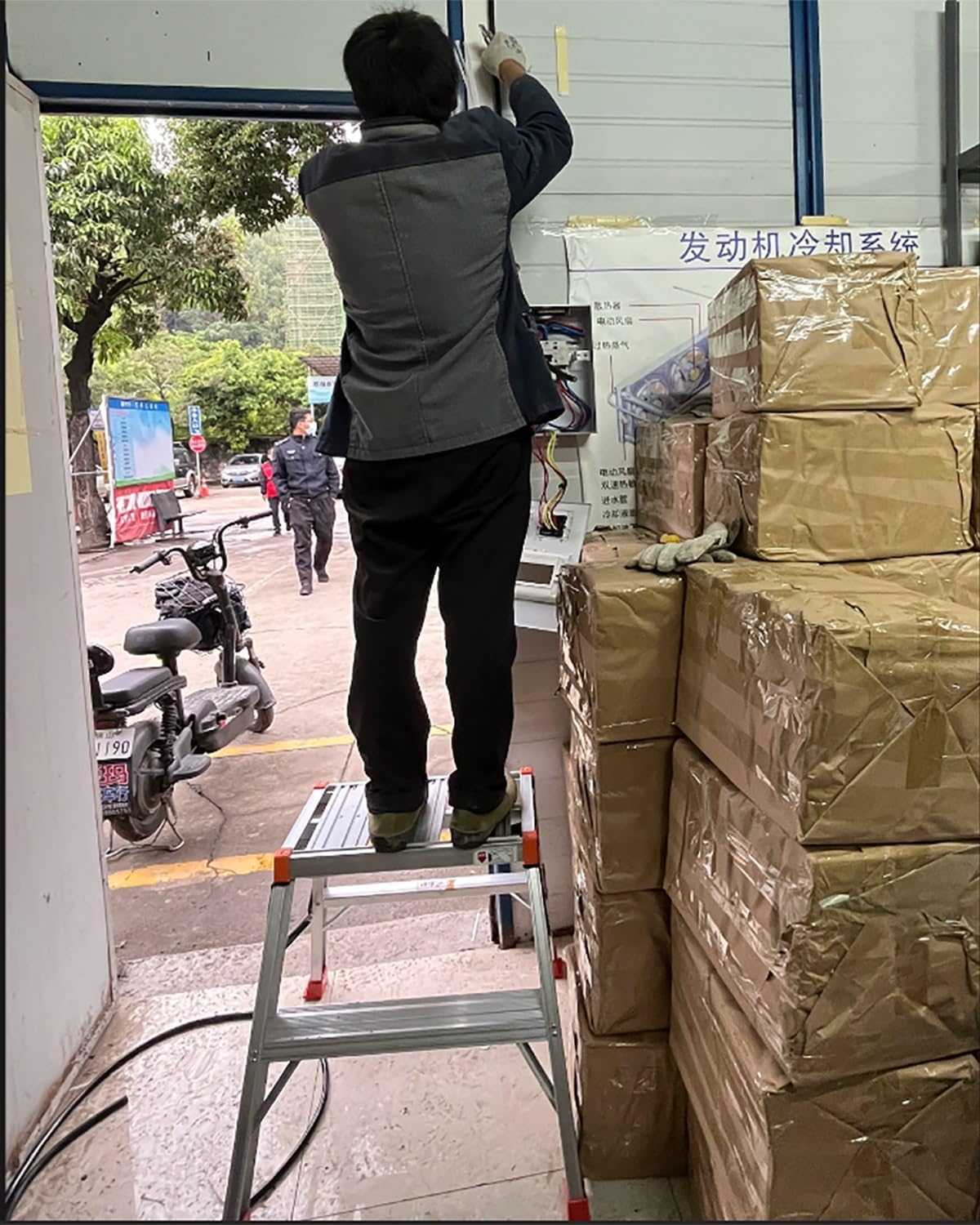A person standing on the work platform performing a task.