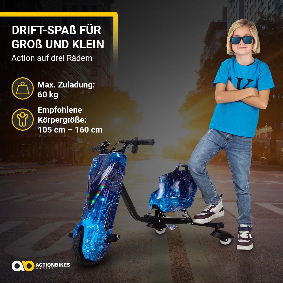 Actionbikes Motors Drift Scooter per Bambini 360 Gradi - Motore Elettrico da 250 Watt - 3 Livelli di Velocità - Illuminazione LED - Sedile Regolabile (Space Blue)