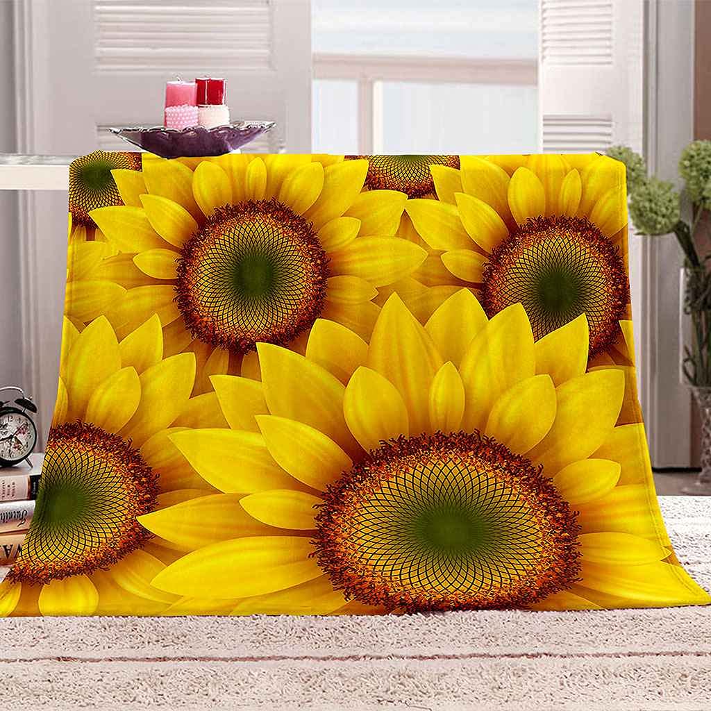 Couverture flanelle tournesol jaune pour un canapé cocooning en toutes saisons