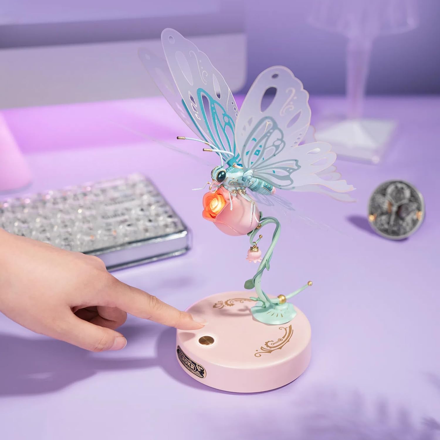 Hand pressing button on the butterfly base