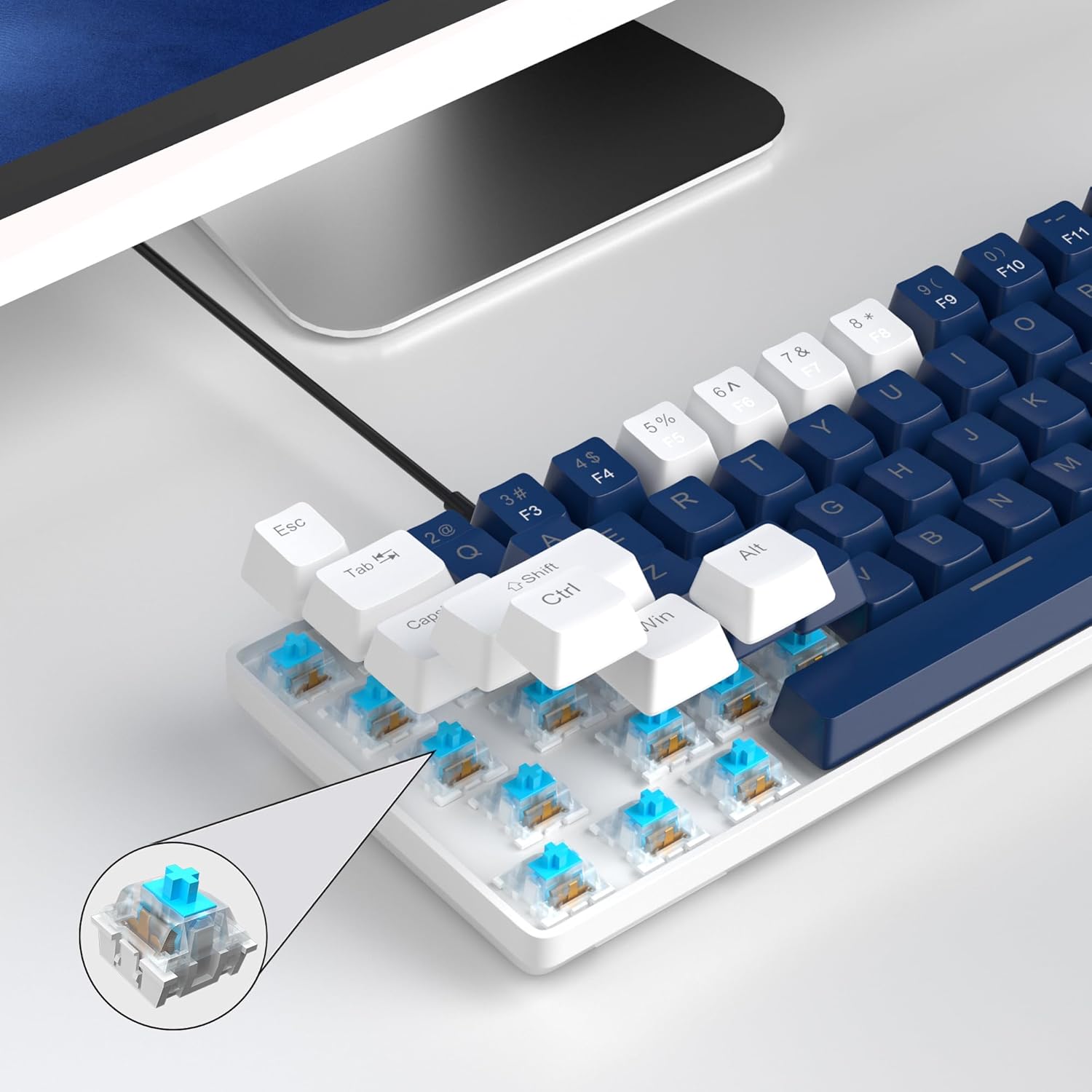 ภาพระยะใกล้ view of a mechanical blue switch on the MageGee MK-Box keyboard, showing its internal mechanism.