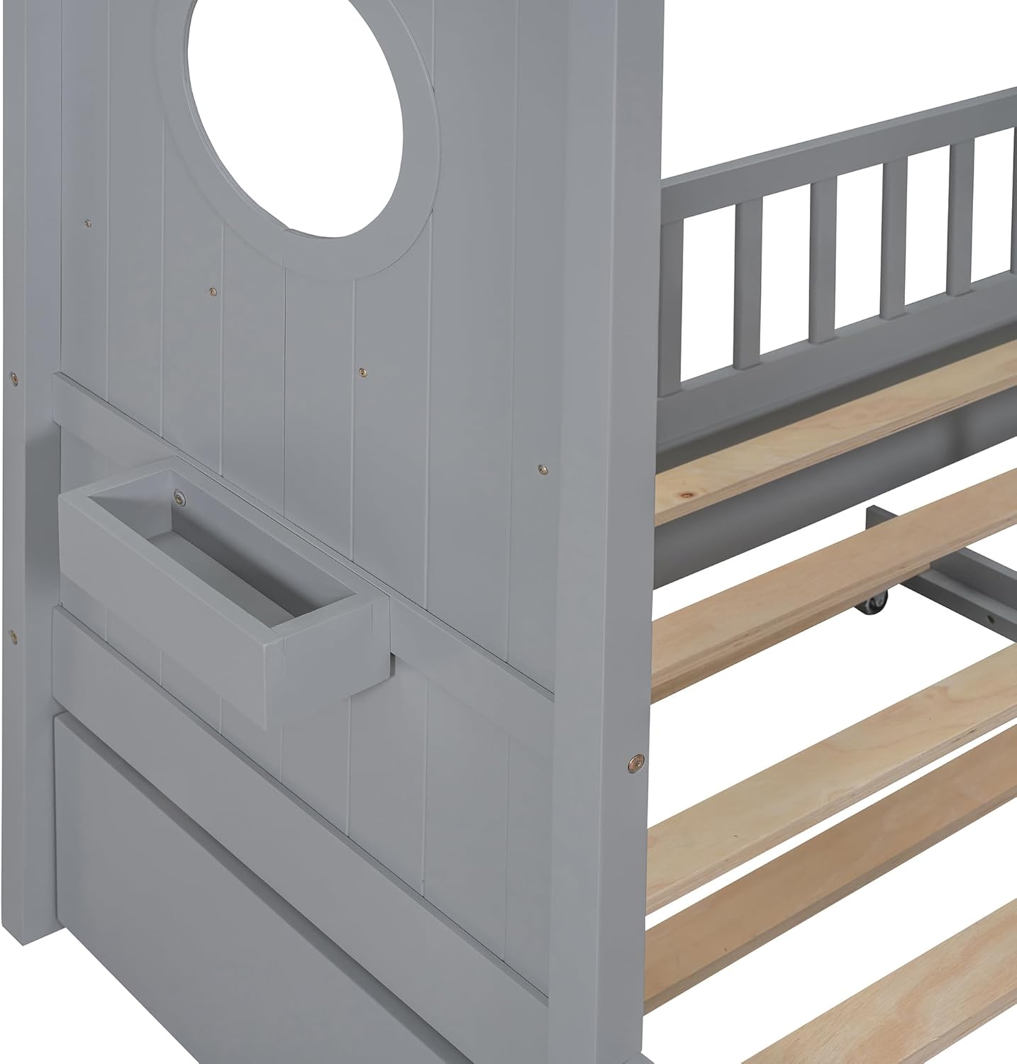 Close-up view of the trundle bed wheels and frame connection