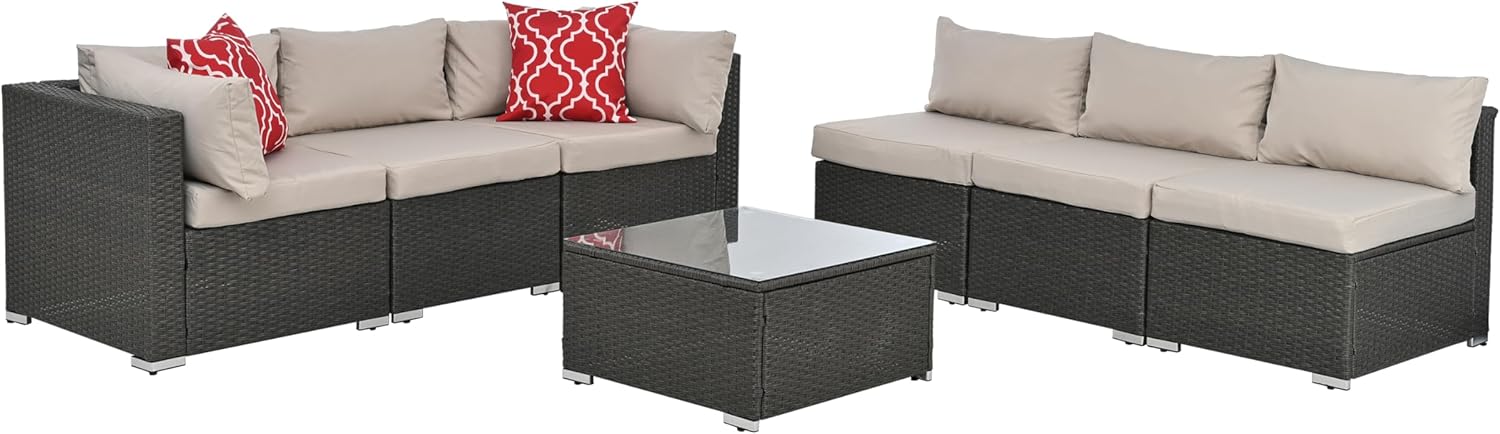 Modular patio furniture arranged in two separate sections with a table