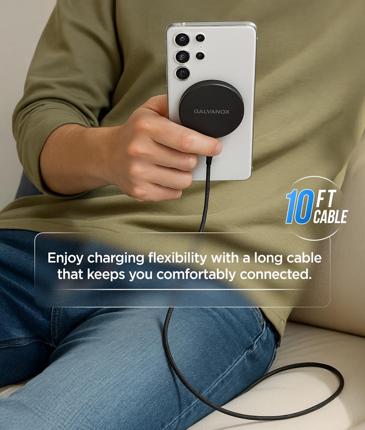 A person holding a white Samsung phone with the Galvanox charger attached, demonstrating the 10-foot cable's length and flexibility.