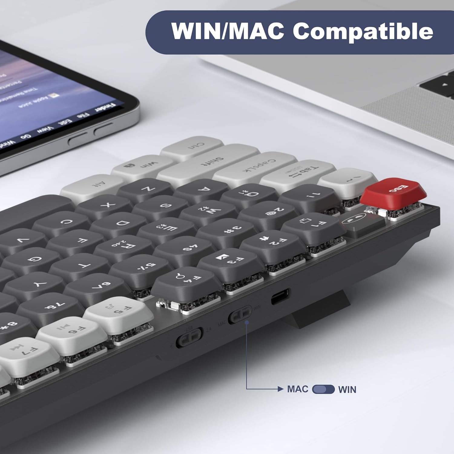 Close-up of the MageGee Moon104 keyboard showing the physical switch for Windows/Mac compatibility