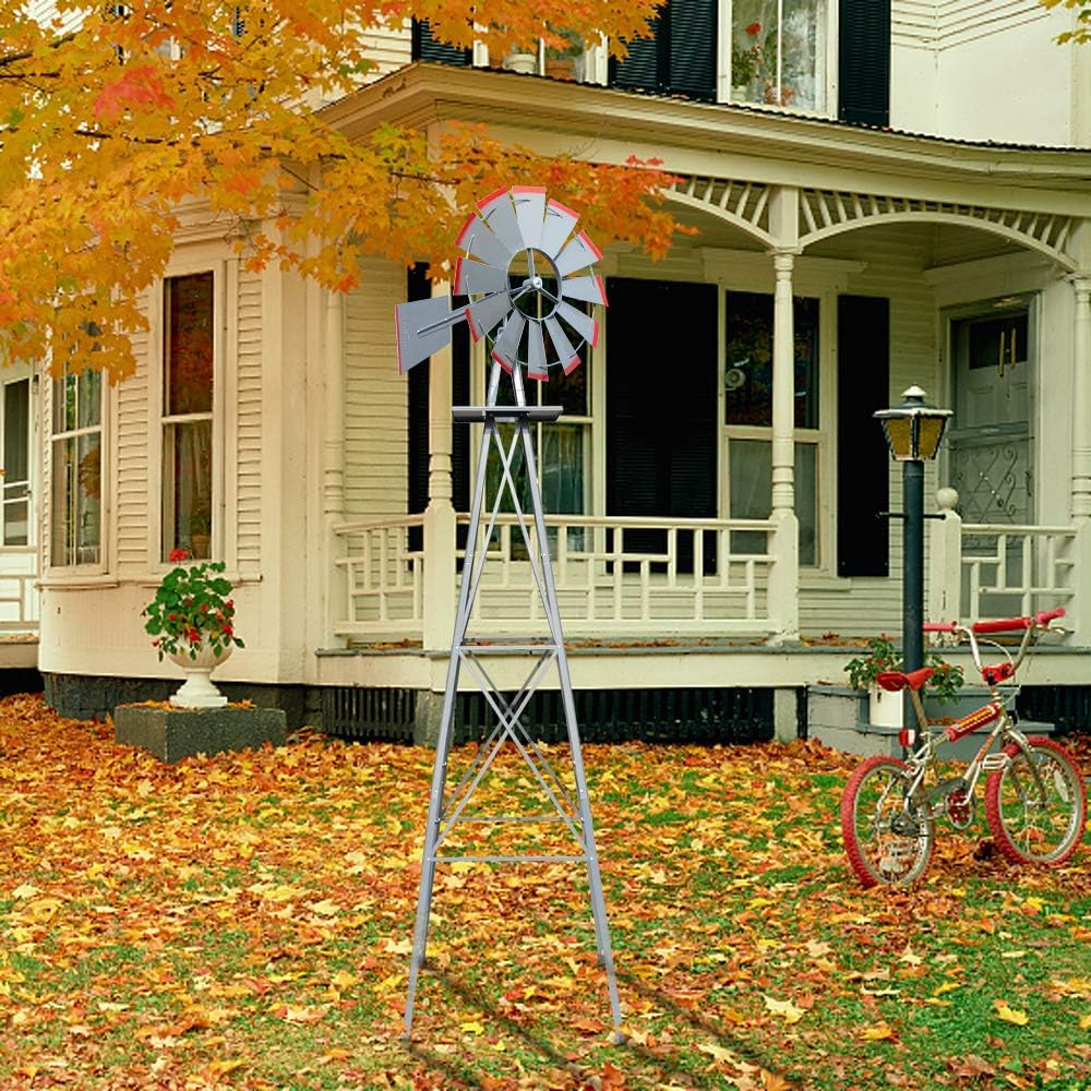 The VINGLI 8FT Ornamental Windmill positioned in a front yard with a house and autumn leaves in the background.