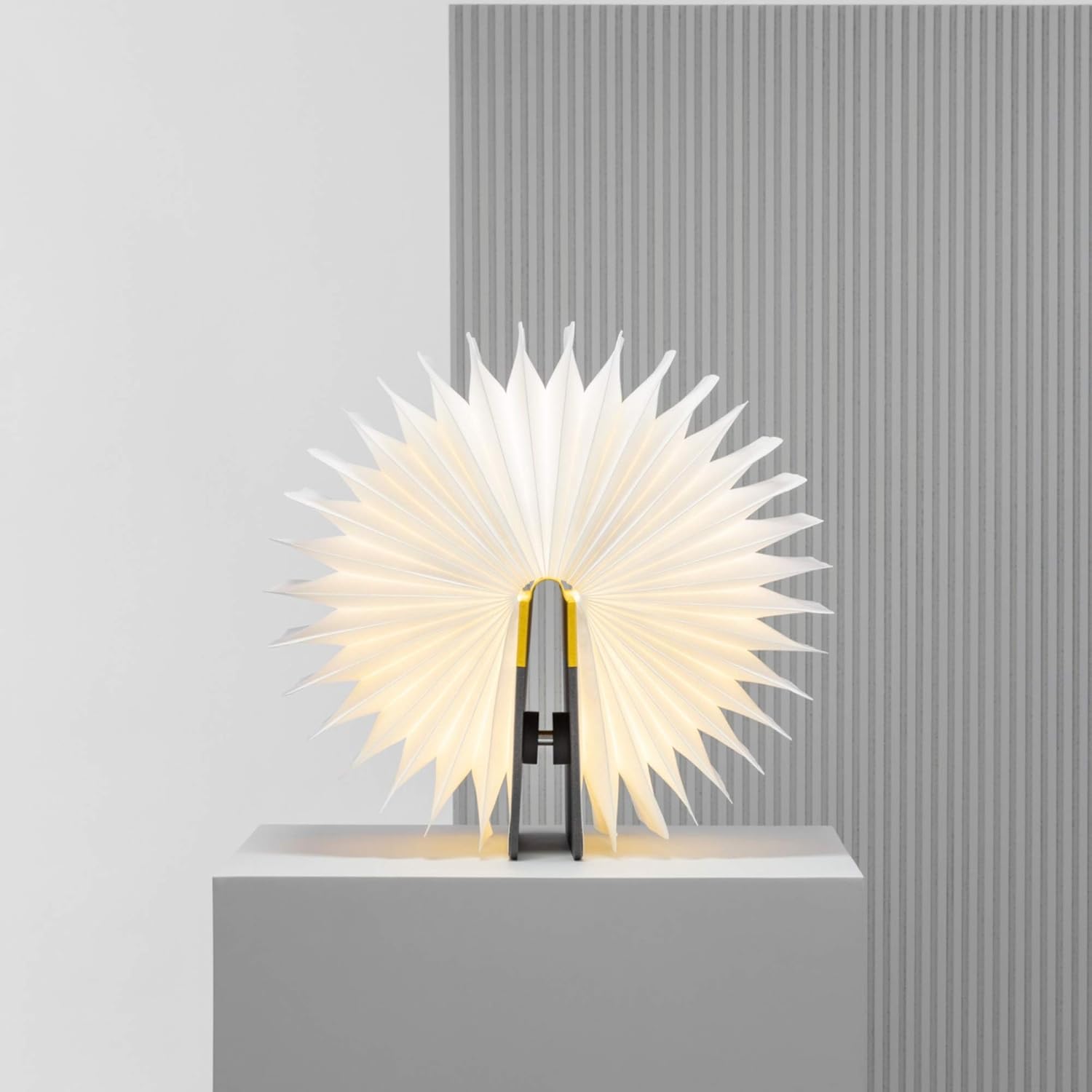 Lito lamp fully opened into a circular fan shape, providing wide illumination.