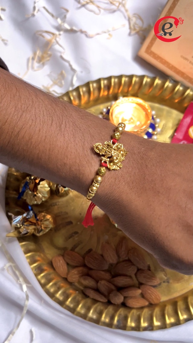 eCraftIndia Golden Religious Designer Ganesha Rakhi for Brother