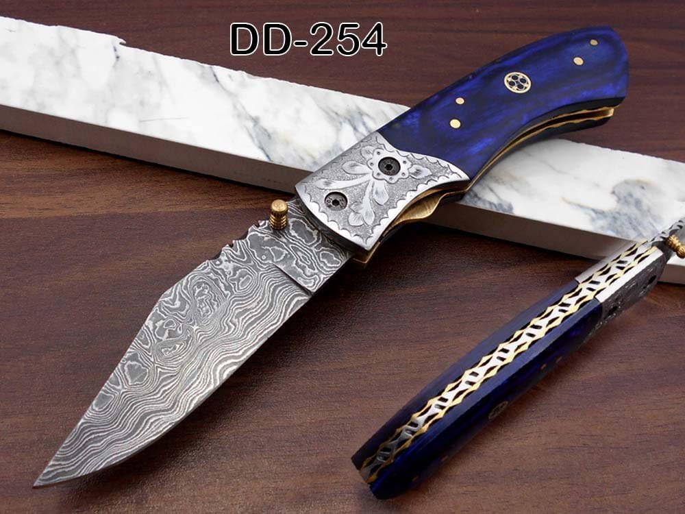 Damascus steel folding knife, 8.3" long knife with hand forged 4" blade, Blue Colored Bone & custom made engraved steel bolster scale, Cow Hide Lather sheath included
