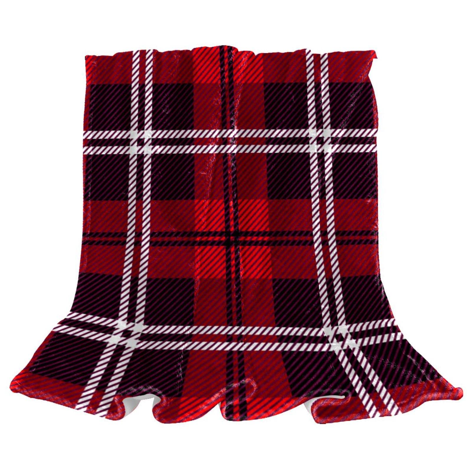 Couverture polaire Noël à carreaux rouge pour vos soirées cocooning au salon