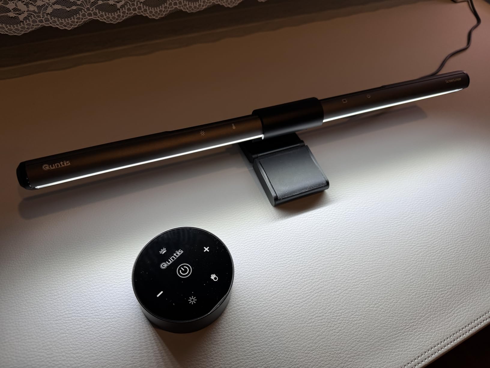 Monitor light bar turned on, showing light spread on desk