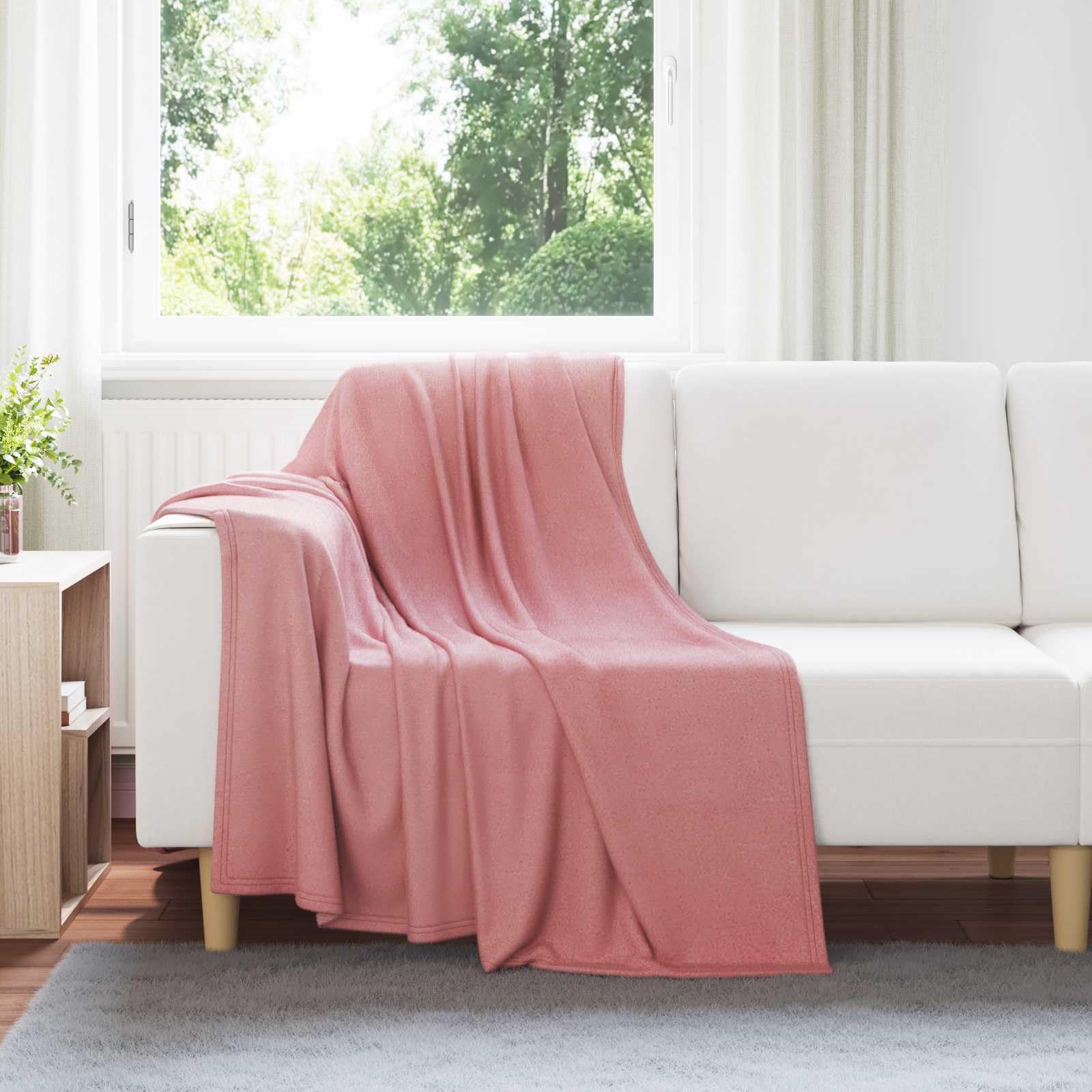 Couvertures à jeter en toison rose pour soirées fraîches en terrasse et salons