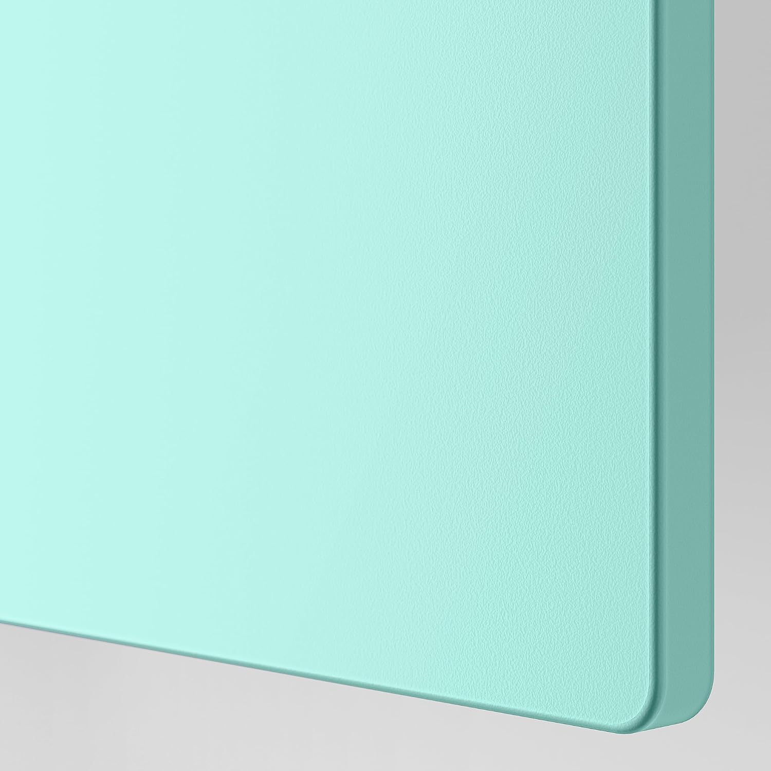 Close-up of the pale turquoise door panel material