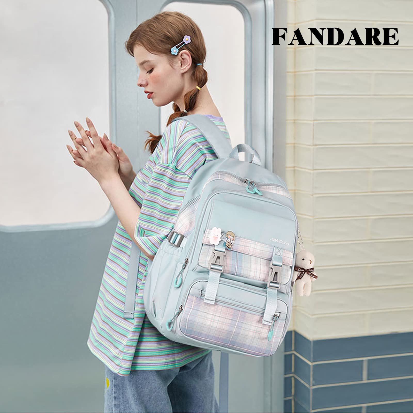 FANDARE Schulrucksack Schulrucksack Schultasche Herren Damen Rucksack Schulranzen für Outdoor Reise Daypacks Freizeitrucksack Rucksack mit Plüschanhänger & Nettes Abzeichen Wasserdicht Nylon Blau