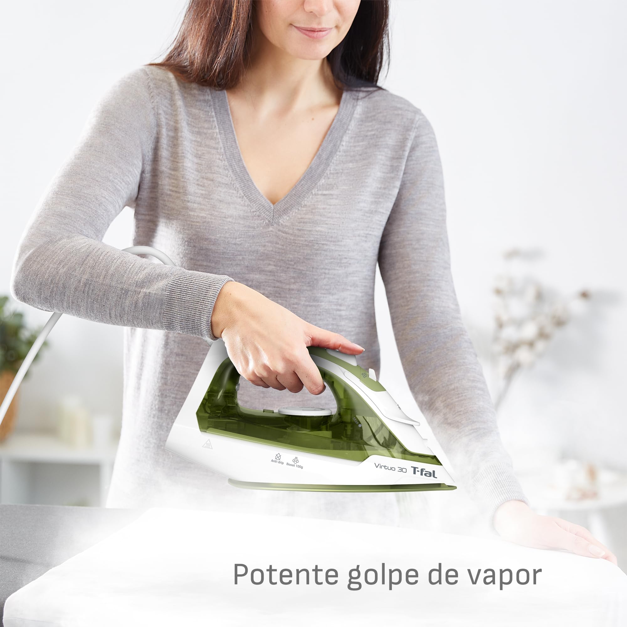 T-fal Virtuo 30 Steam Iron in use, demonstrating efficient ironing with 1400 watts of power