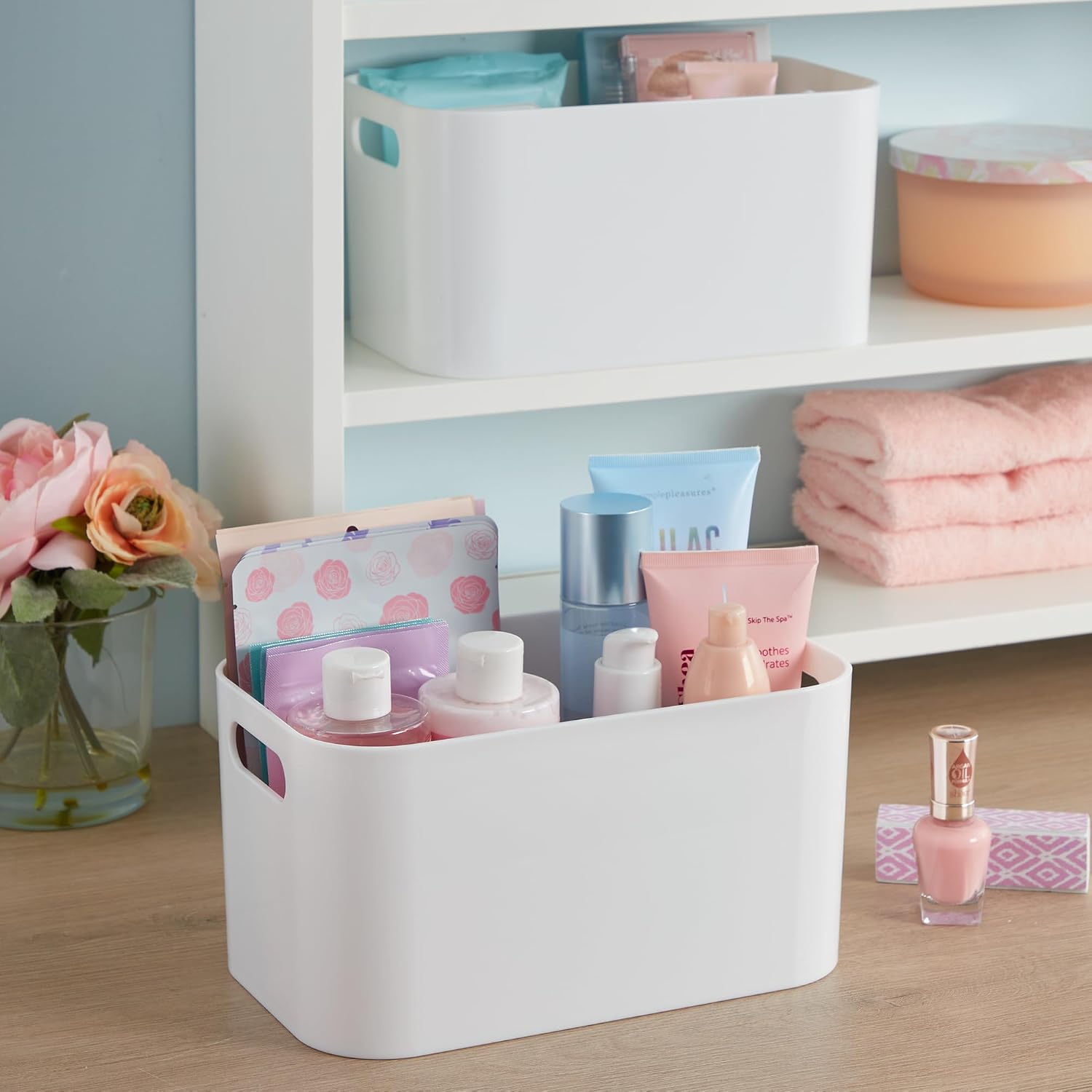 STORi Bliss organizer on a vanity table, filled with beauty products and surrounded by other vanity items.