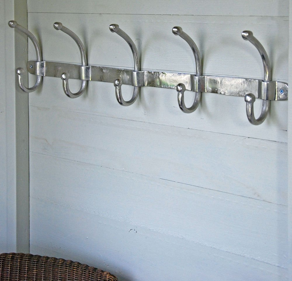 Bowley & Jackson Row of five aluminium wall mounted coat hooks