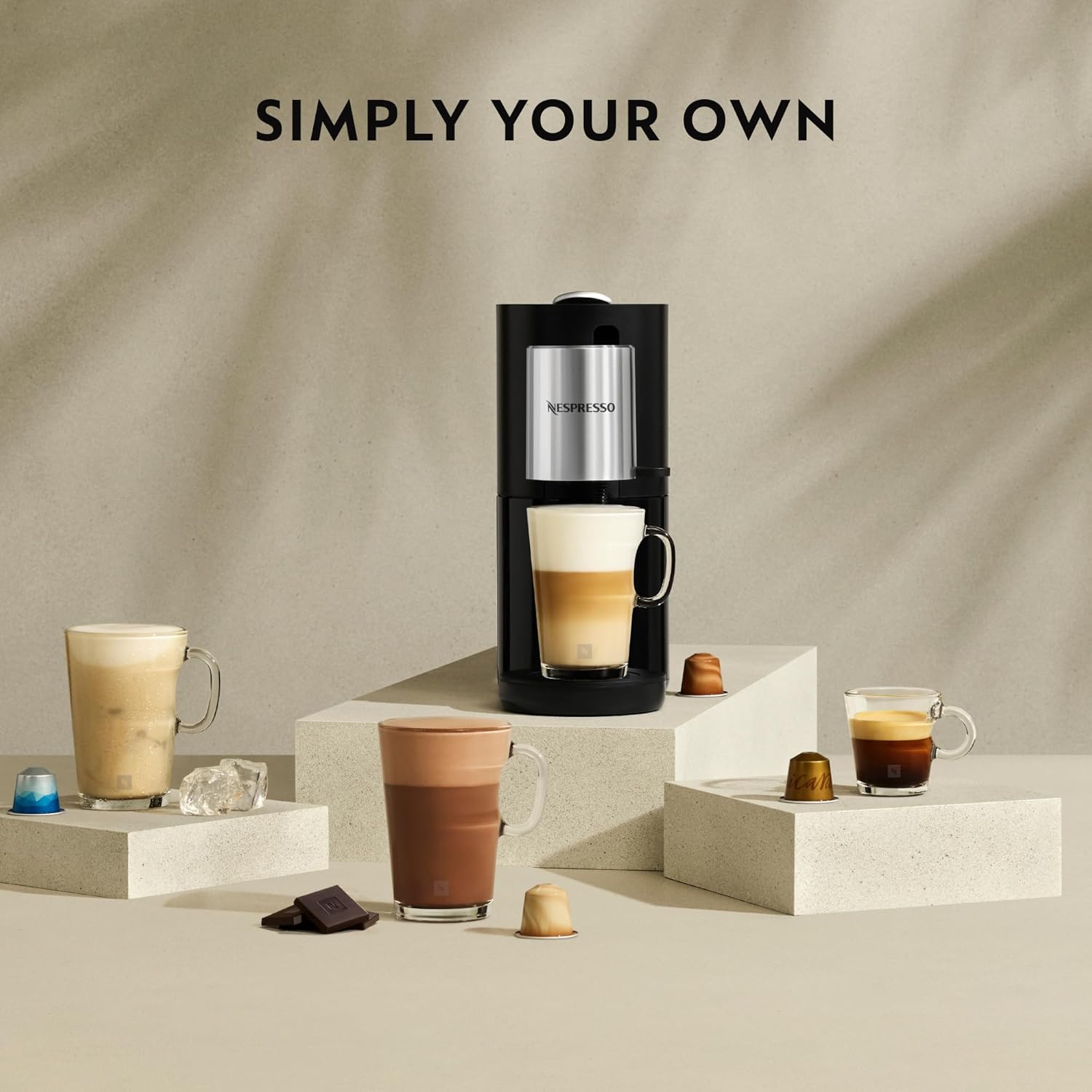 Various coffee drinks prepared by Nespresso Atelier S85, including espresso, lungo, and milk-based coffees