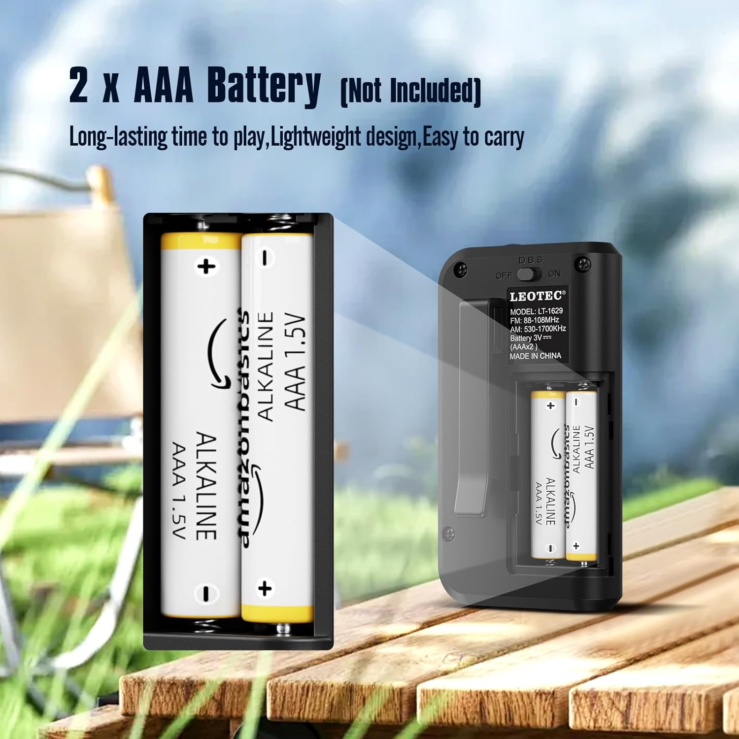 Open battery compartment of the radio showing AAA battery slots