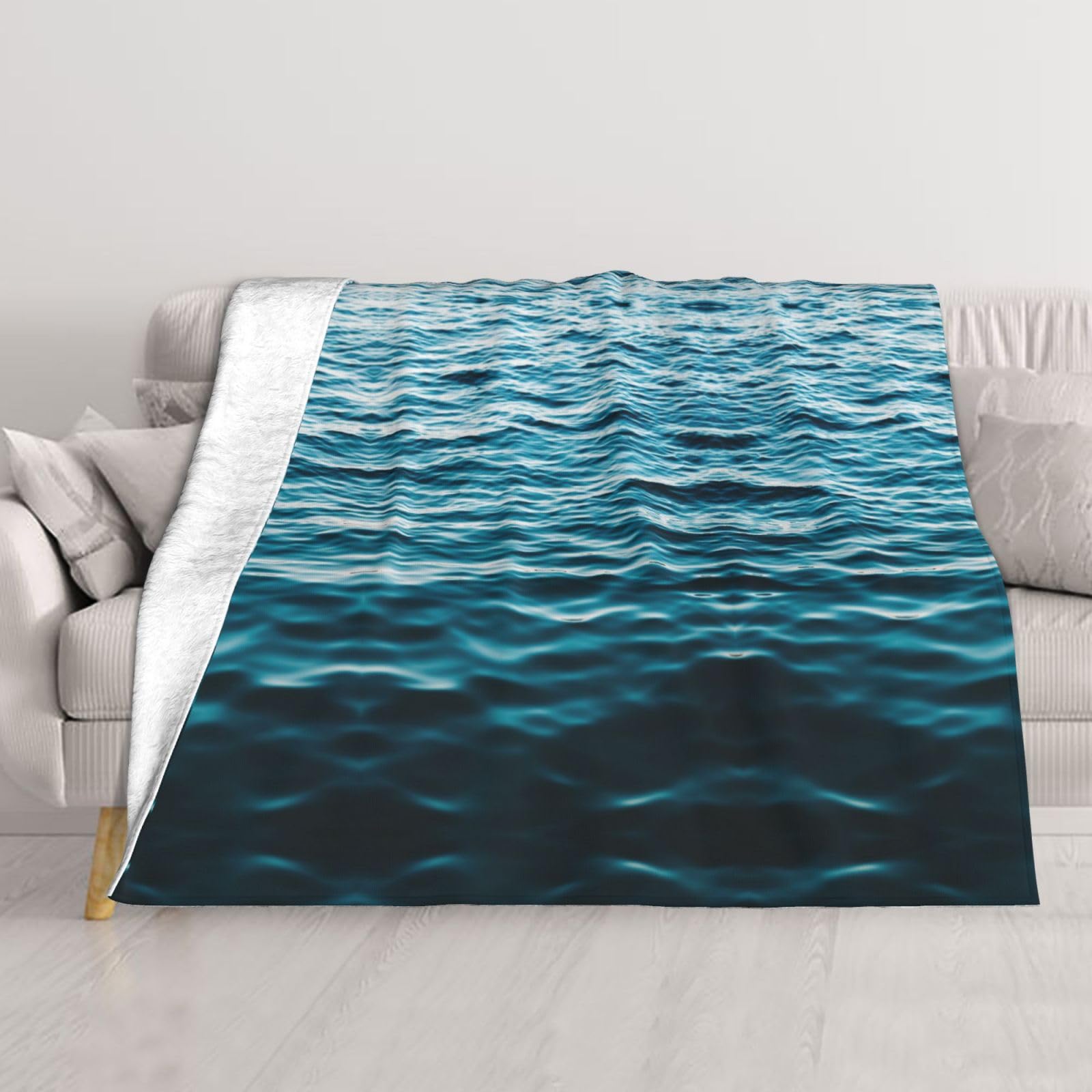 Couverture imprimée sur fond d'eau pour vos soirées cocooning sur le canapé