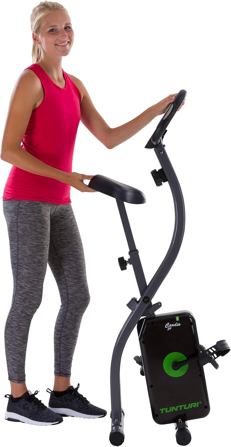 User folding the Tunturi Cardio Fit B20 X-Bike for storage