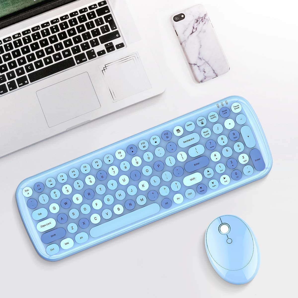 User typing on Muvit Candy keyboard with monitor