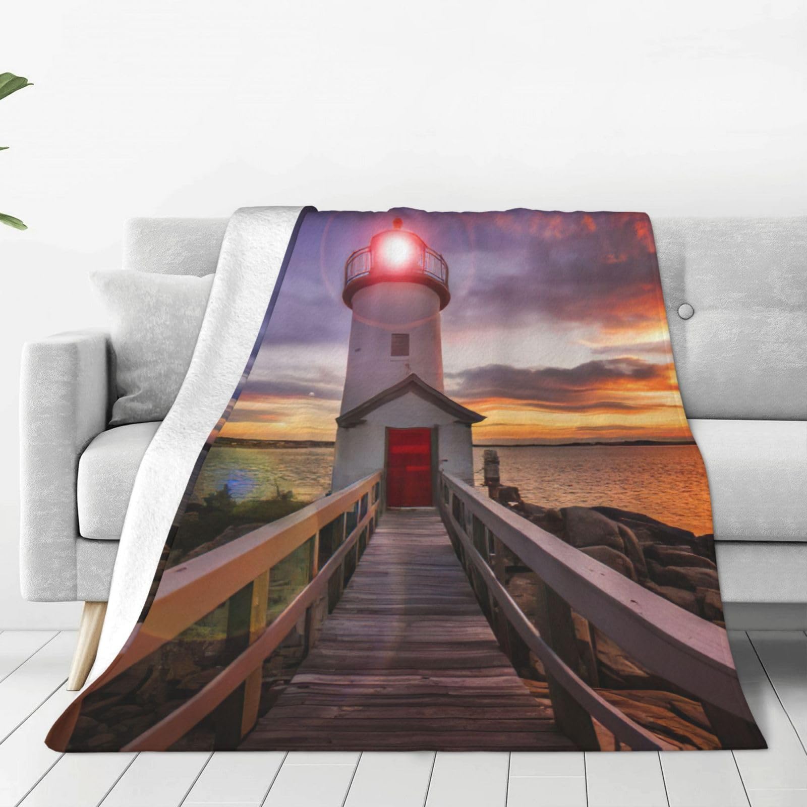 Couverture polaire chaude imprimé phare pour vos soirées cocooning sur le canapé