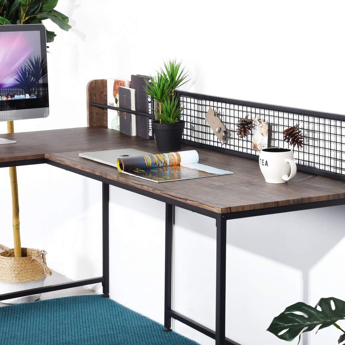 Close-up of desktop surface with laptop and magazine