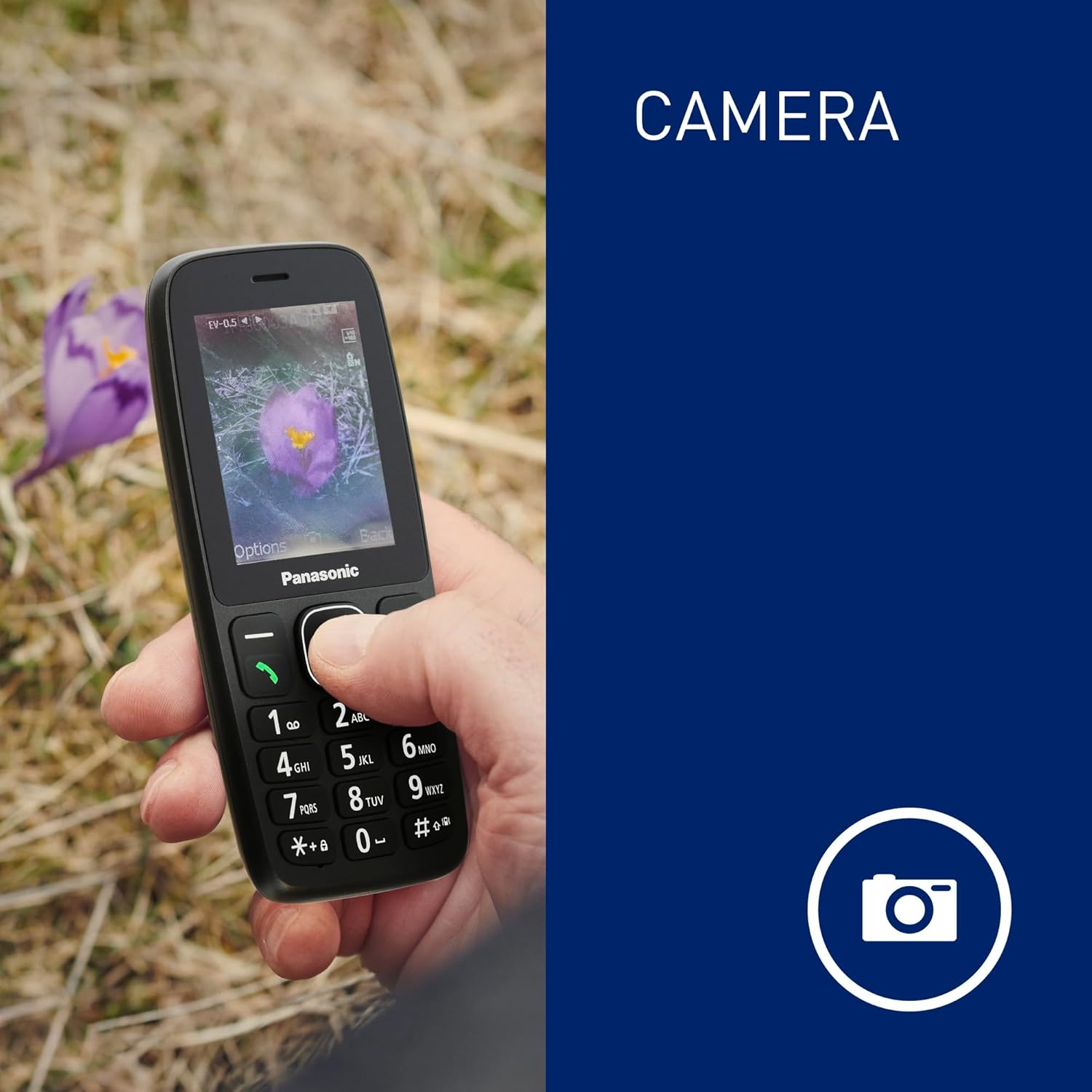 Hand holding Panasonic KX-TF400EXB phone displaying a photo taken with its camera.