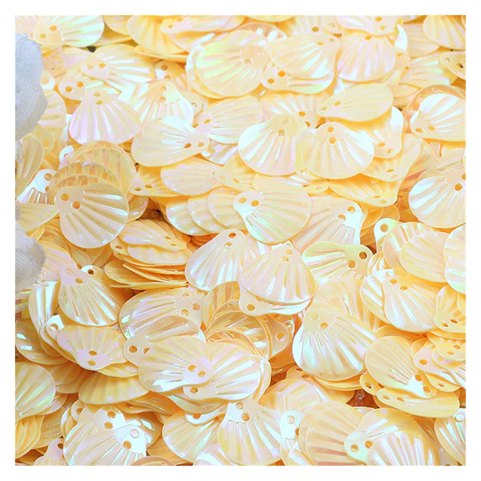 Paillettes en PVC forme coquillage yellow de 10g pour customisation couture