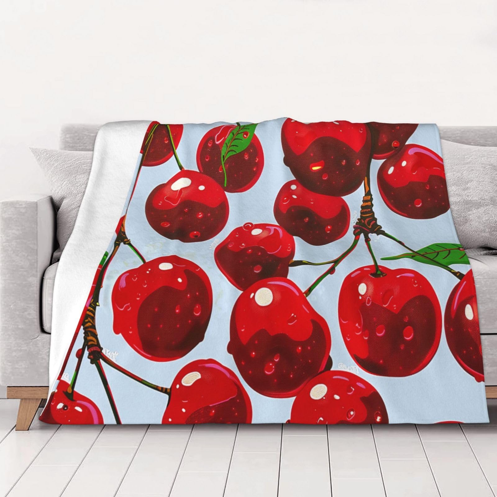 Couverture en flanelle cerises pour canapé et soirées cocooning