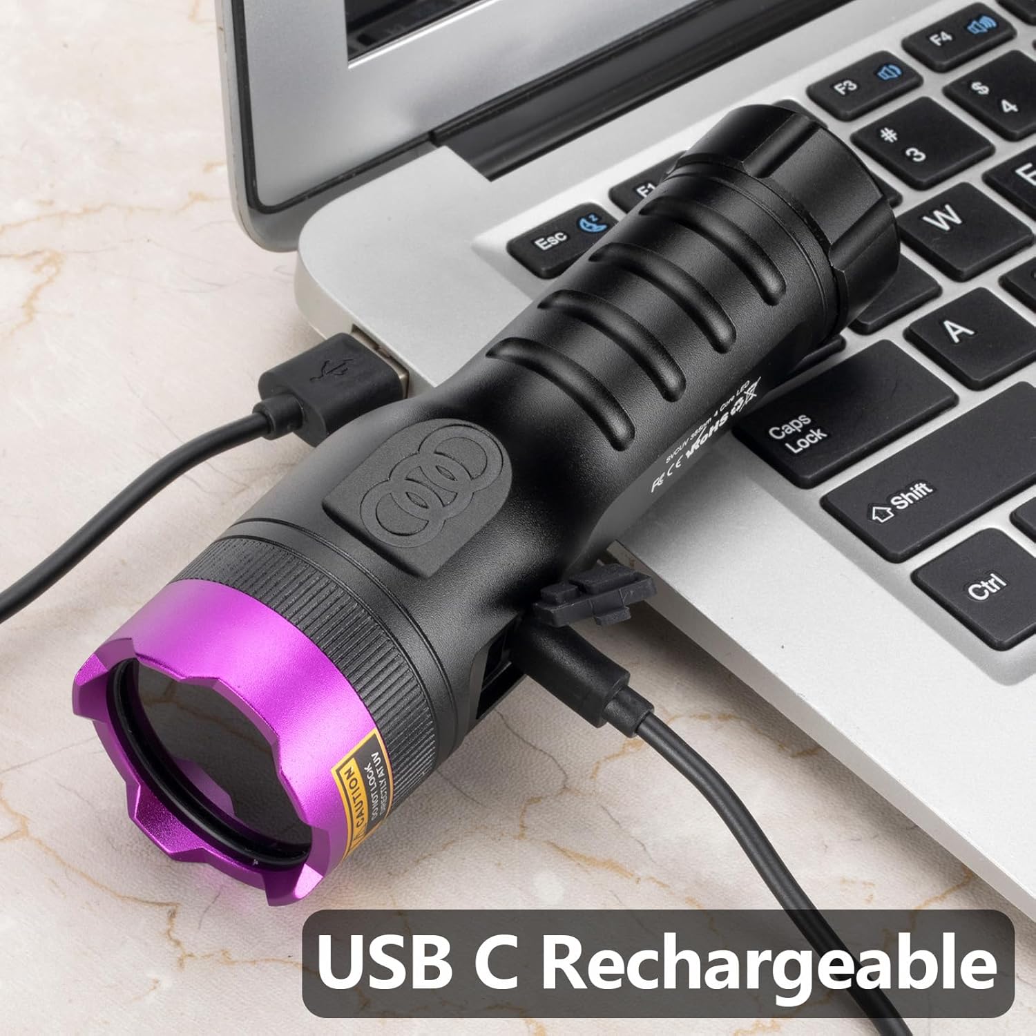 Alonefire SV71 flashlight connected to a laptop via USB-C cable for charging